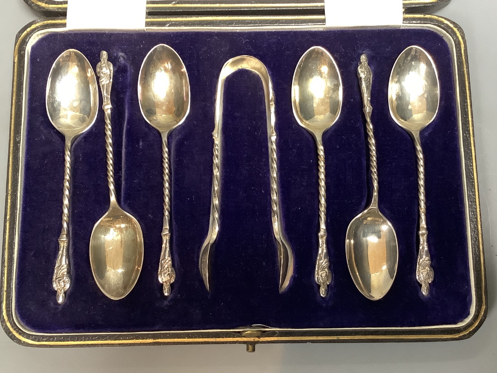 A cased set of six George V silver apostle teaspoons and a pair of sugar tongs, Cooper Brothers & Sons, Sheffield, 1921.